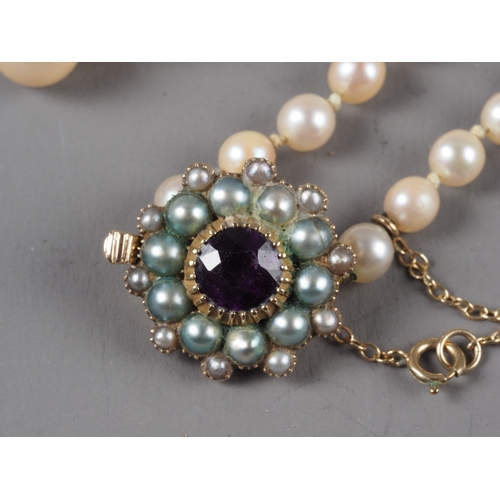 329 - A late 19th century single strand graduated cultured pearl necklace, with yellow metal, amethyst and... 