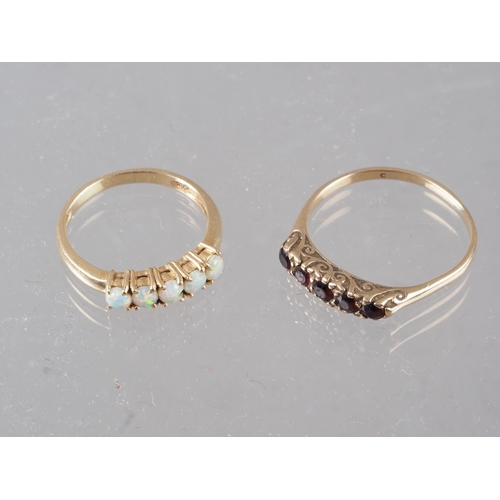 344 - A 14ct gold and five stone opal ring, size N, 2.2g, and a 9ct gold five stone garnet ring, size S, 2... 