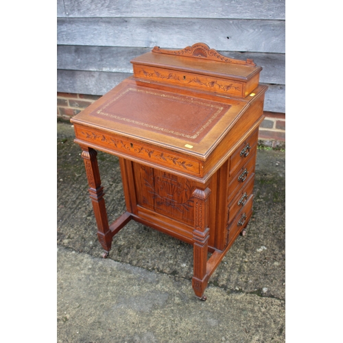 518 - A 19th century walnut Davenport desk with raised stationery compartment, fitted four drawers, on cas... 