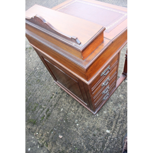 518 - A 19th century walnut Davenport desk with raised stationery compartment, fitted four drawers, on cas... 