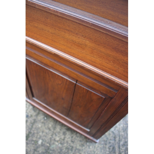 518 - A 19th century walnut Davenport desk with raised stationery compartment, fitted four drawers, on cas... 