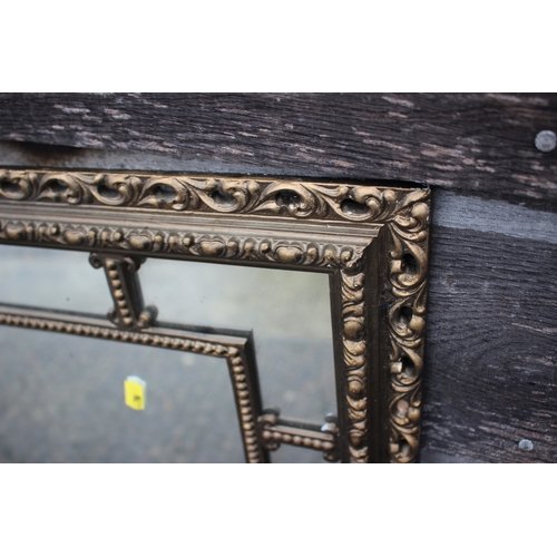569 - A gilt frame wall mirror with 