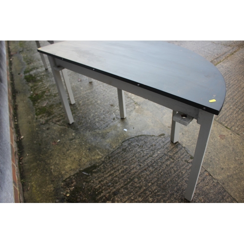 591 - A pair of grey painted and black top semicircular console tables, on square taper supports, 50