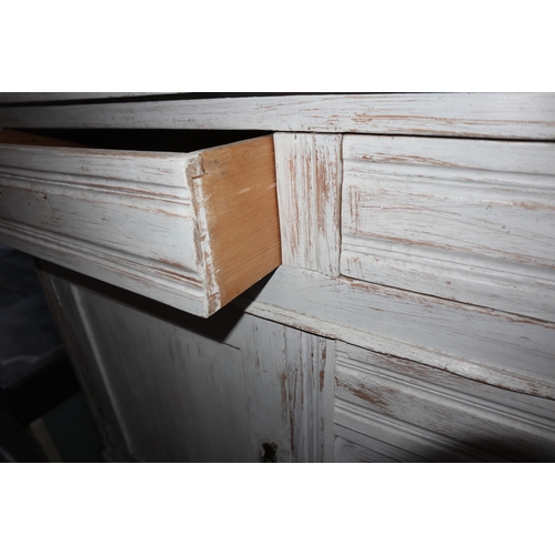 587 - A white painted dresser, the upper section fitted two glazed doors and open shelves over four drawer... 