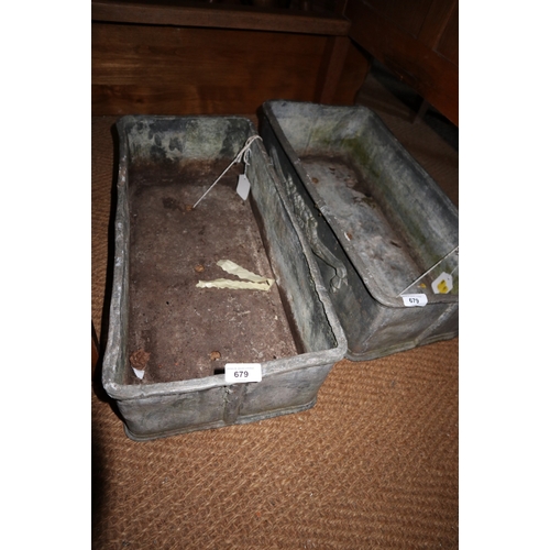 679 - A pair of cast lead rectangular planters with floral and swag decoration, 22