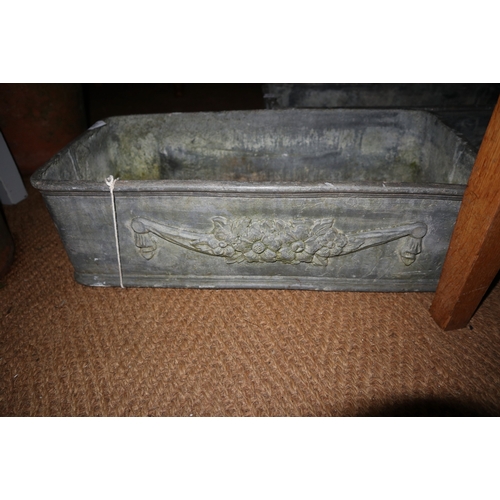 679 - A pair of cast lead rectangular planters with floral and swag decoration, 22