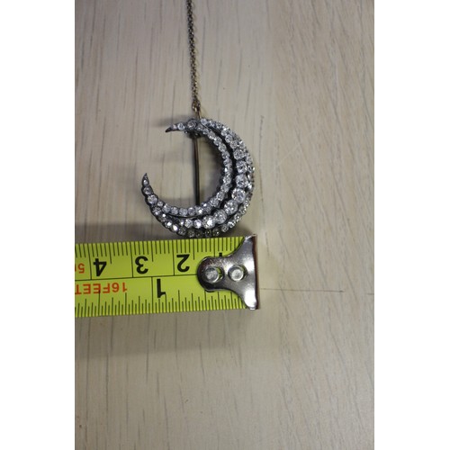 359 - A Victorian white metal and old cut diamond brooch formed as a crescent moon
