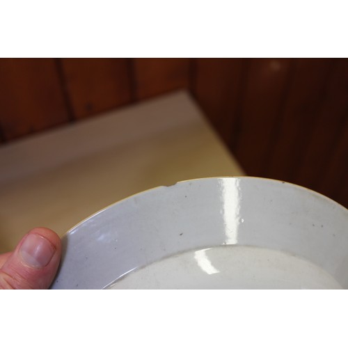 94 - A Chinese Famille Rose dish with central interior scene, figures and precious object decoration surr... 