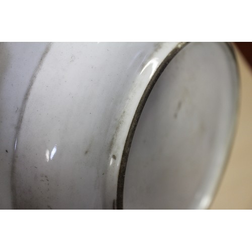 94 - A Chinese Famille Rose dish with central interior scene, figures and precious object decoration surr... 