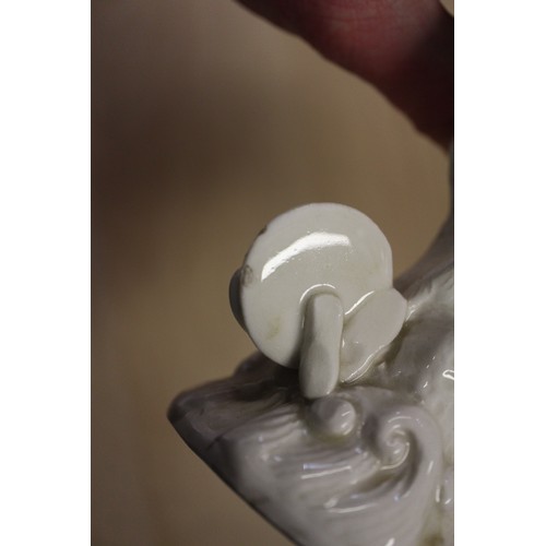 94 - A Chinese Famille Rose dish with central interior scene, figures and precious object decoration surr... 