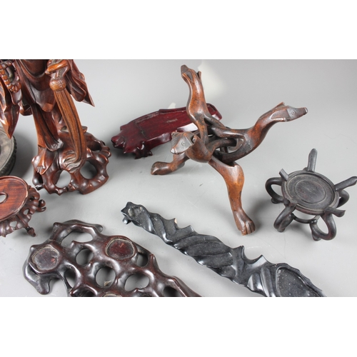 97 - A Chinese carved hardwood figure, 15