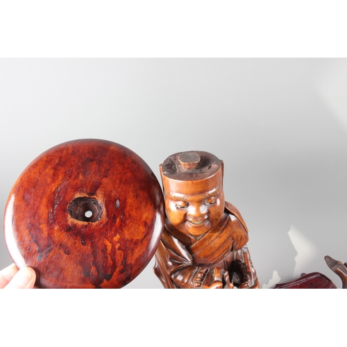 97 - A Chinese carved hardwood figure, 15