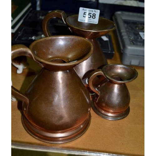 558 - 3x Copper Measure Jugs