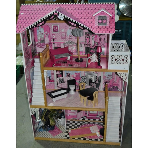 104 - Large 3 Tiered Doll House + Bag Of Accessories