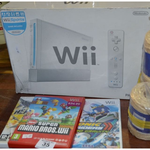 35 - Nintendo Wii Boxed + 3 x Wii Games ( Mario & Sonic Olympic Games, Heatseeker + Super Mario Bros