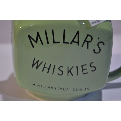 434 - Arklow Pottery Millars Whiskies, Wines ,Cordials Jug. A Millar & Co Ltd Dublin