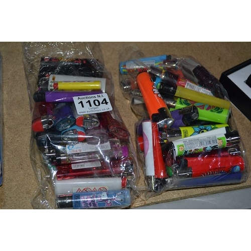 1104 - 2 Bags Of Lighters Including Clipper