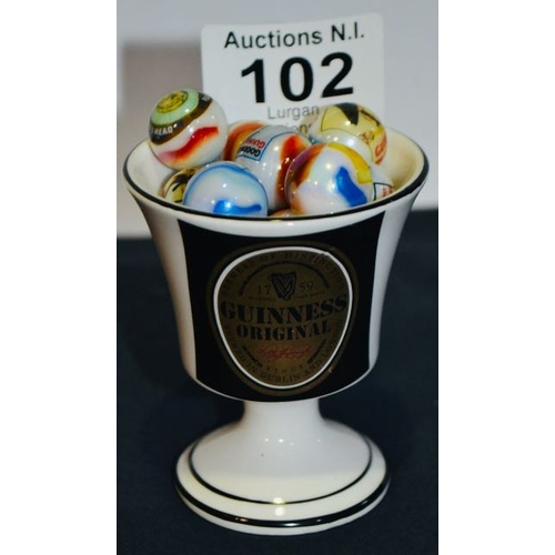 102 - Staffordshire Bone China Guinness  Mini Cup Containing 16 Guinness Marbles All Depicting Different I... 