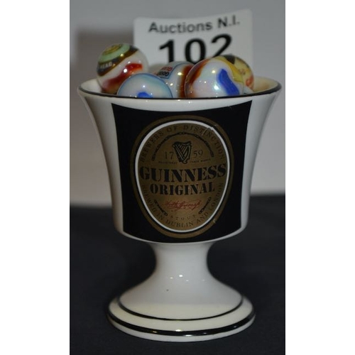 102 - Staffordshire Bone China Guinness  Mini Cup Containing 16 Guinness Marbles All Depicting Different I... 