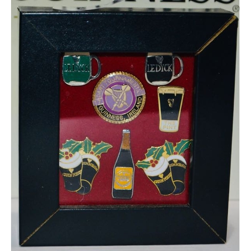 130 - Mounted Guinness Badge Collection in Frame Incl Guinness Ireland Dart Tournament, 2x Guinness Tankar... 