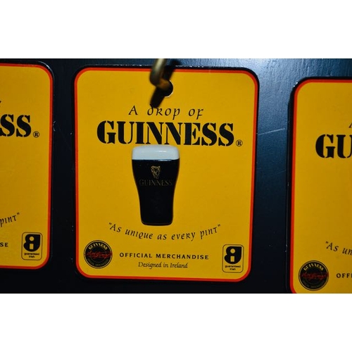 394 - A Drop of Guinness 'As Unique as Every Pint' Official Merchandise Badge x 9 on Display Stand