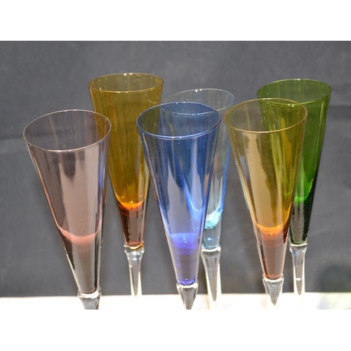 284 - 6 x Coloured Champagne Flutes In Wooden Stand