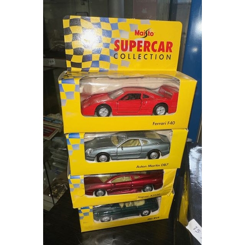 678 - 4 x  Boxed Maisto Supercar Collection - Ferrari F40 + Aston Martin DB7 + Jaguar XJ220 + MG RV8