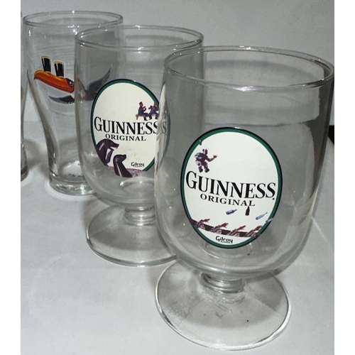 7 - 4 Gilroy Footed Guinness Glasses Plus 2 Toucan Half Pint Glasses, One Containing Marbles