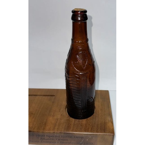 9 - Special Bottle Drop 1739 - 1959 Atlantic Ocean Guinness Bottle On Wooden Plinth to Celebrate Guinnes... 