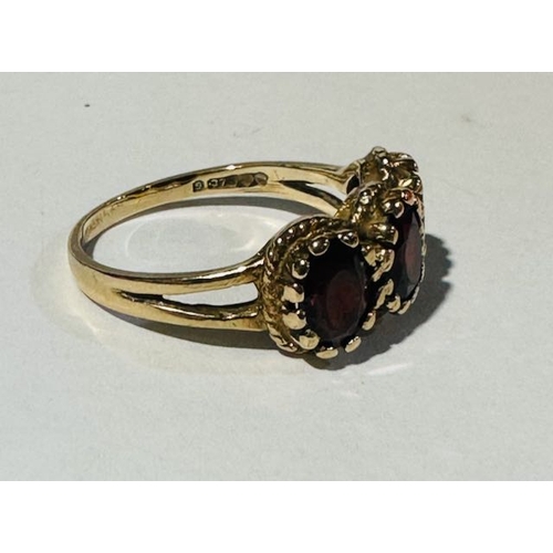 322 - 9ct Gold Garnet Triliogy Ring