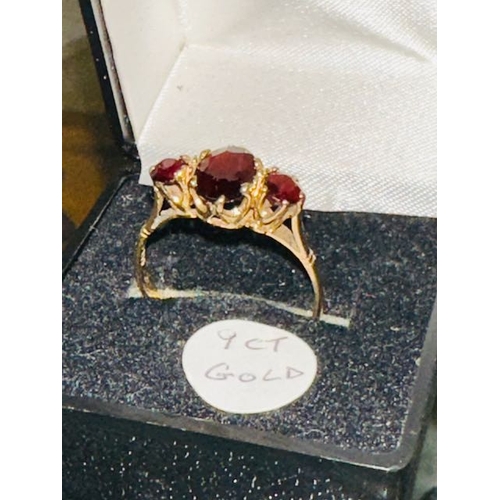 329 - 9ct Gold Garnet Triology Ring