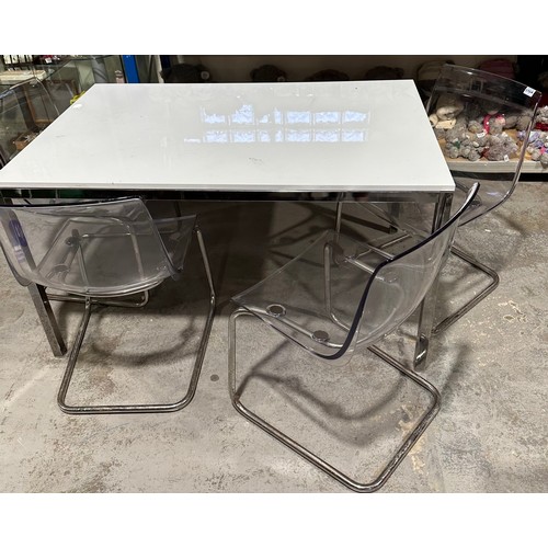 575A - White Gloss Top Table On Chrome Base + 4 x Clear Perspex Chairs