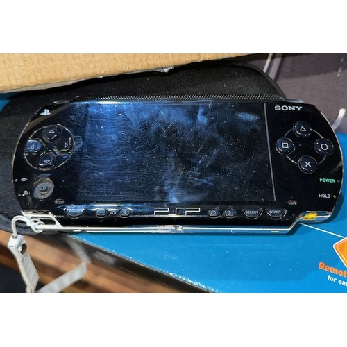 1 - Sony PSP + Soft Case + Selection of Games & UMD Videos ( No Charger, Working)