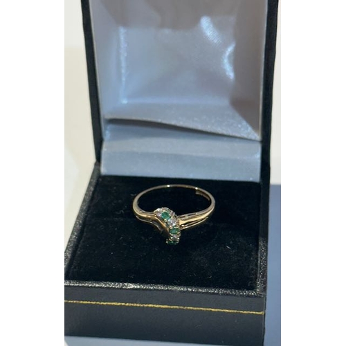 306 - 9ct Diamond & Emerald Ring