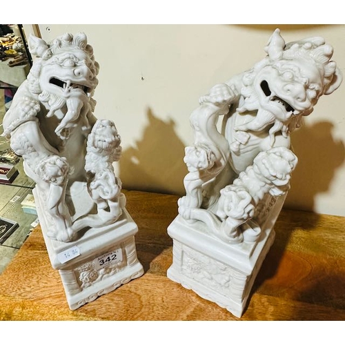 342 - 2x Antique Chinese Porcelain 'Blanc De Chine' Foo Dogs