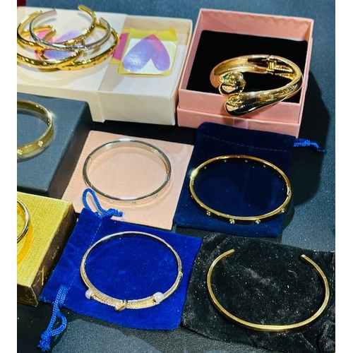 1131 - Large Collection of Gold Tone Bangles