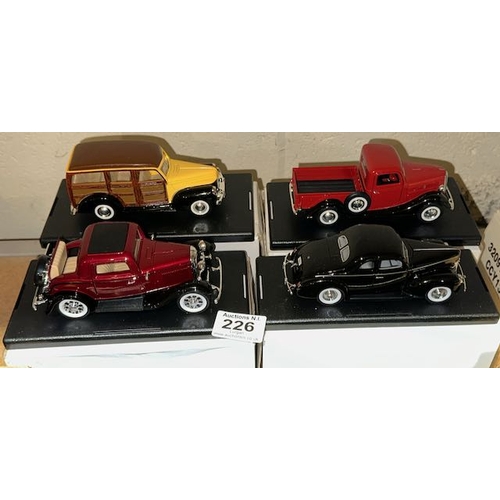 226 - 4 x Boxed Model Ford Trucks On Plinths