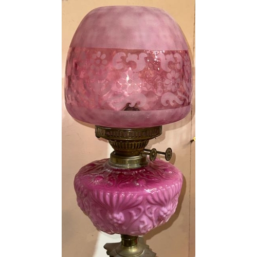 425 - Antique Brass Corinthian Based Oil Lamp with Ornate Pink Glass Reservoir & Cranberry Frosted Shade