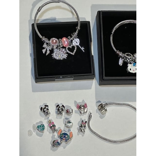 999 - 2 x Hello Kitty + 2 x Lilo & Stitch Charm Bracelets