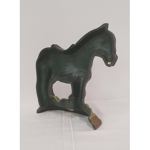 24 - Cast metal door stopper in the form of a saddled horse