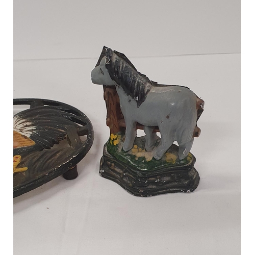 26 - 2 Cast iron animal decorated items, a Trivet and a Door Stop