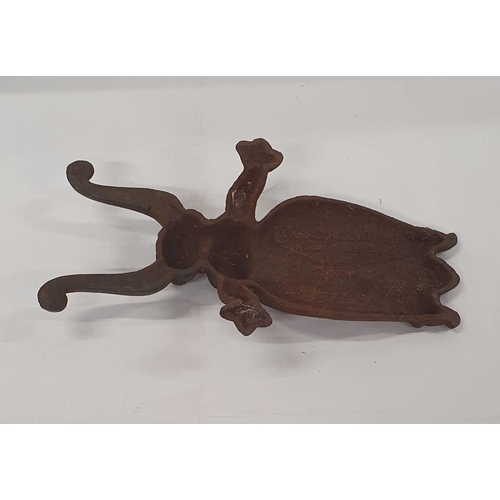 28 - Cast iron door stop / garden ornament in the style of a beetle