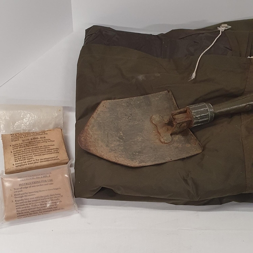 164 - Militaria - A fine collection of vintage military items including a folding shovel, over wrap and me... 