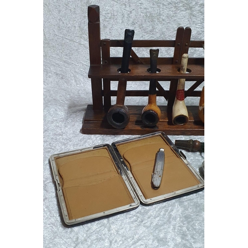 390 - Tobaccanalia - fine group consisting of a Gate style pipe rack, mixture of Meerschaum and briar wood... 