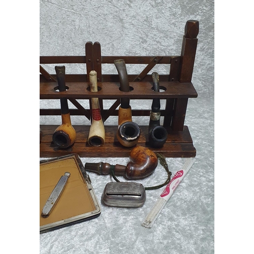 390 - Tobaccanalia - fine group consisting of a Gate style pipe rack, mixture of Meerschaum and briar wood... 