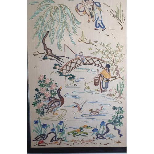 433 - A further similar framed and glazed piece of Japanese needlework art depicting fishing and countrysi... 