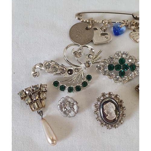 195 - Group of white metal jewellery items, including cameo style brooch and safety pin pendant holder