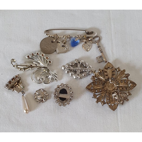 195 - Group of white metal jewellery items, including cameo style brooch and safety pin pendant holder