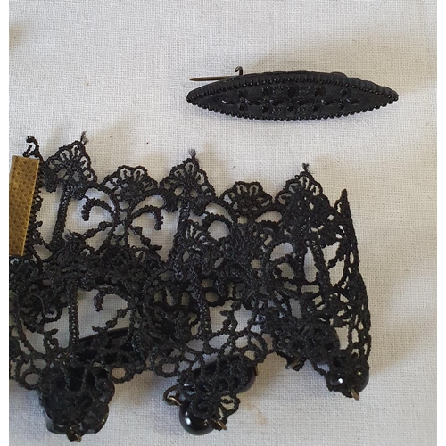 199 - Victorian style items of jewellery including lace choker with brass clasp, jet brooch and necklace