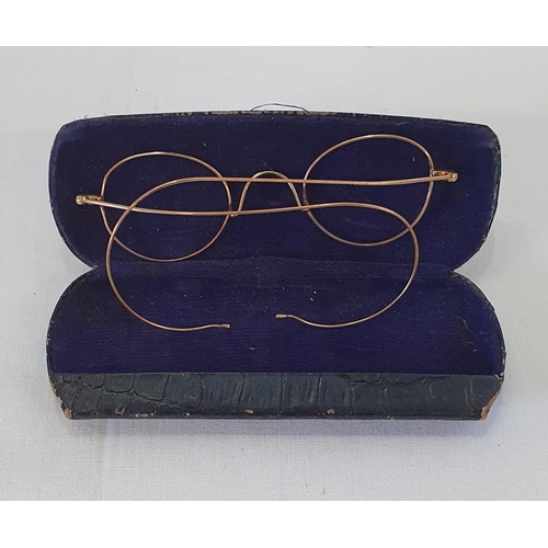 204 - Antique cased pair of gold rimmed wire frame glasses tests as 18k, total weight 5.5grams